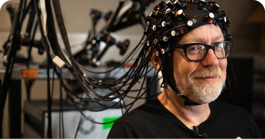 Adam Savage exploring the technology of hearing aids.